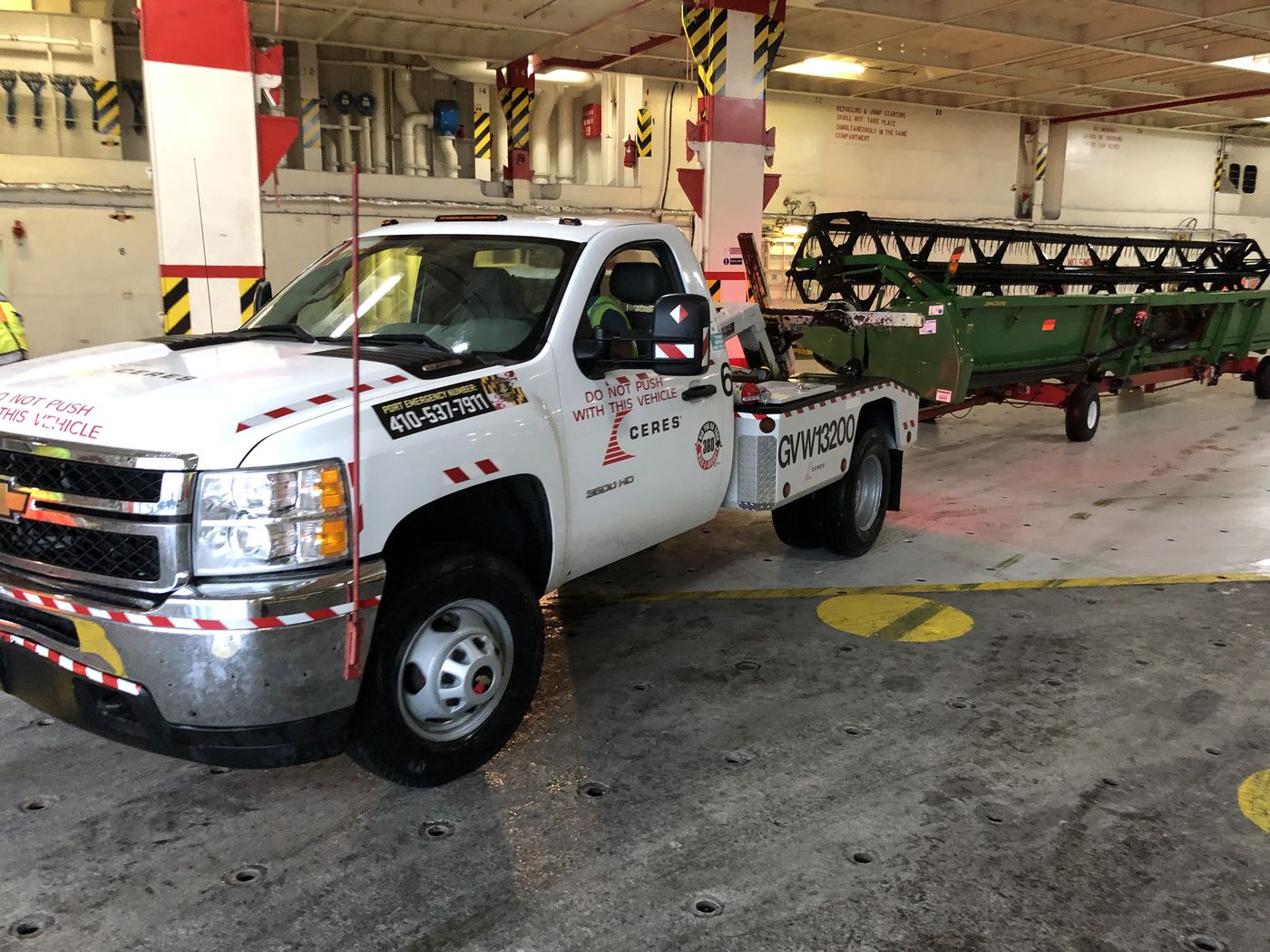 Agricultural harvester loaded inside a vessel